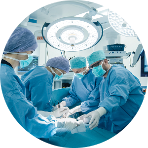 A team of surgeons in scrubs collaborates in a sterile operating room during a surgical procedure